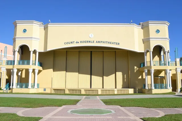 a front view of a building with a yard