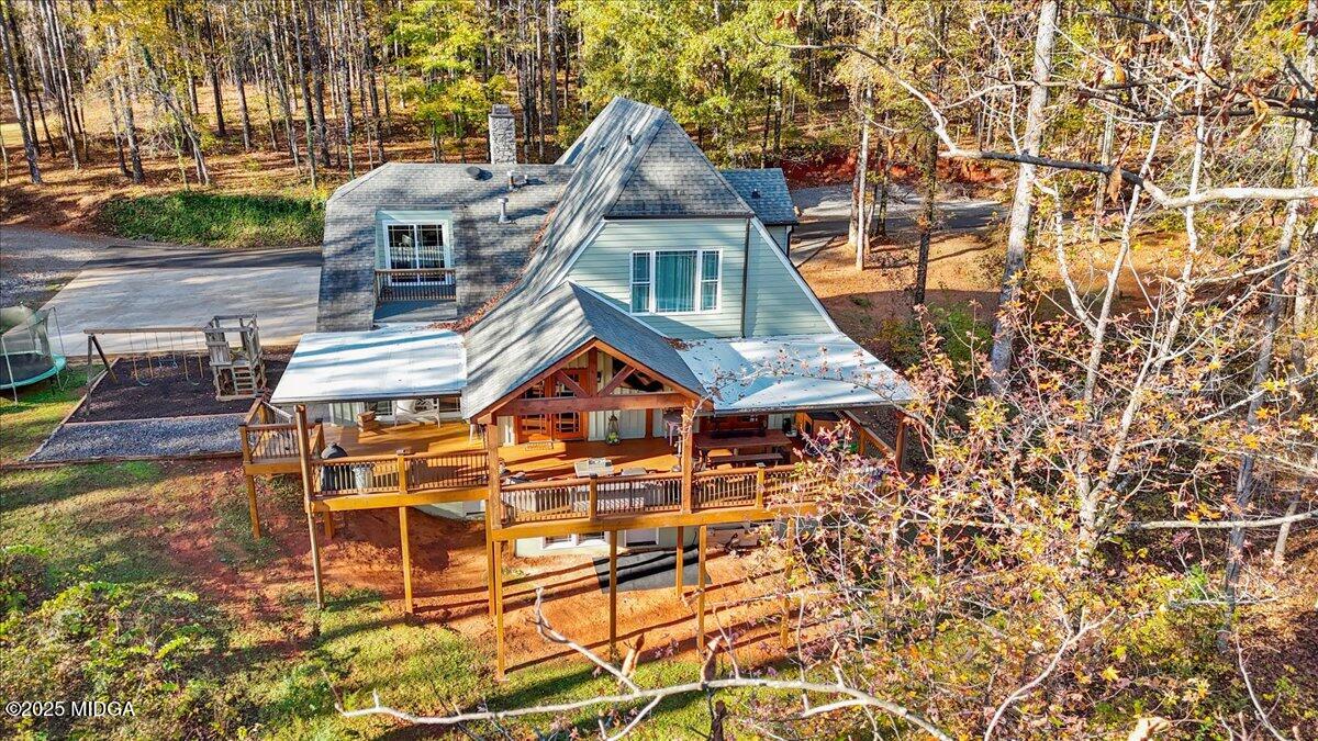 1774 Maynards Mill Road Forsyth, GA 31029 - Photo 15 of 76 a front view of a house with a yard