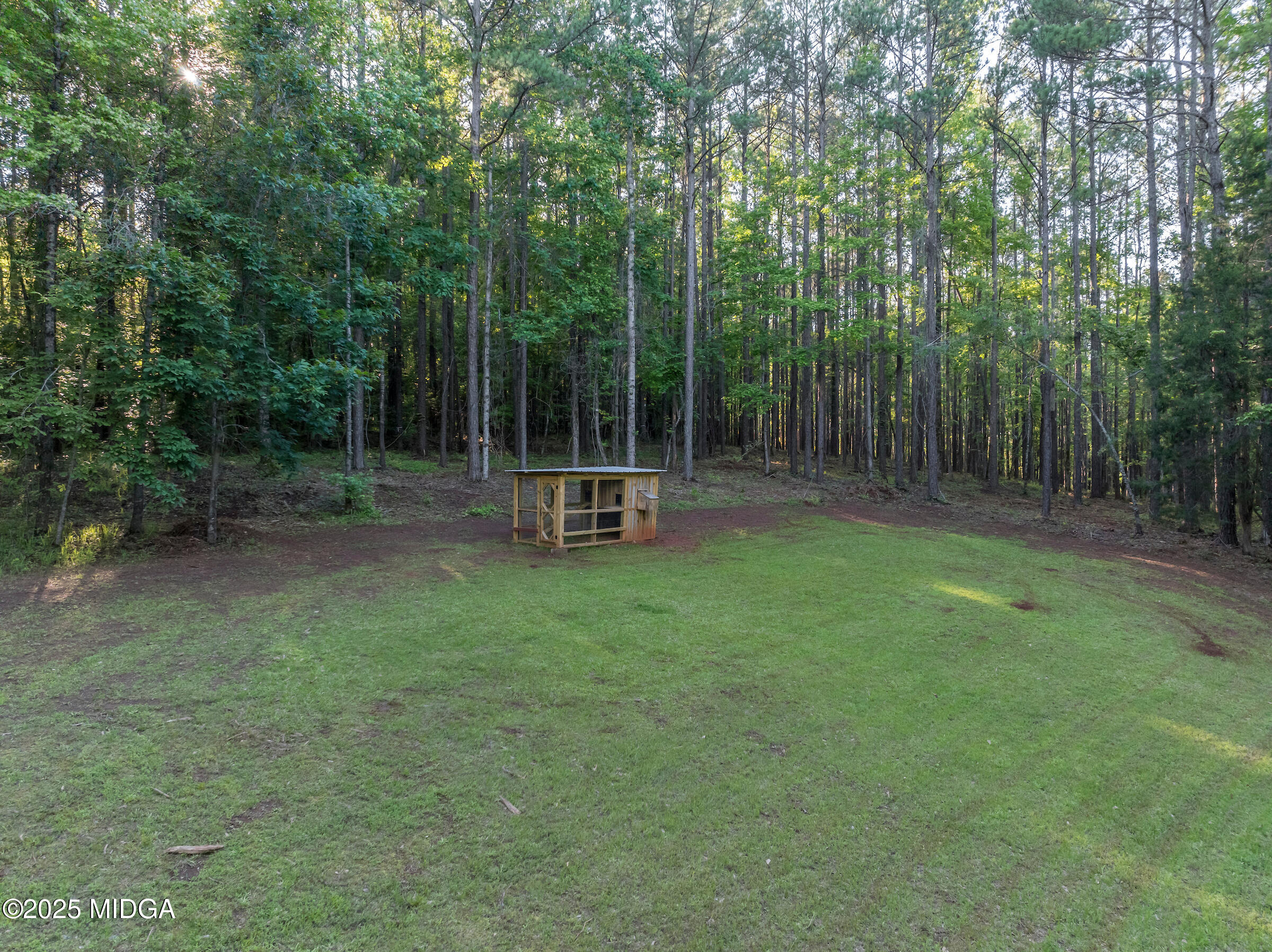 1774 Maynards Mill Road Forsyth, GA 31029 - Photo 19 of 76 a view of a park with a bench