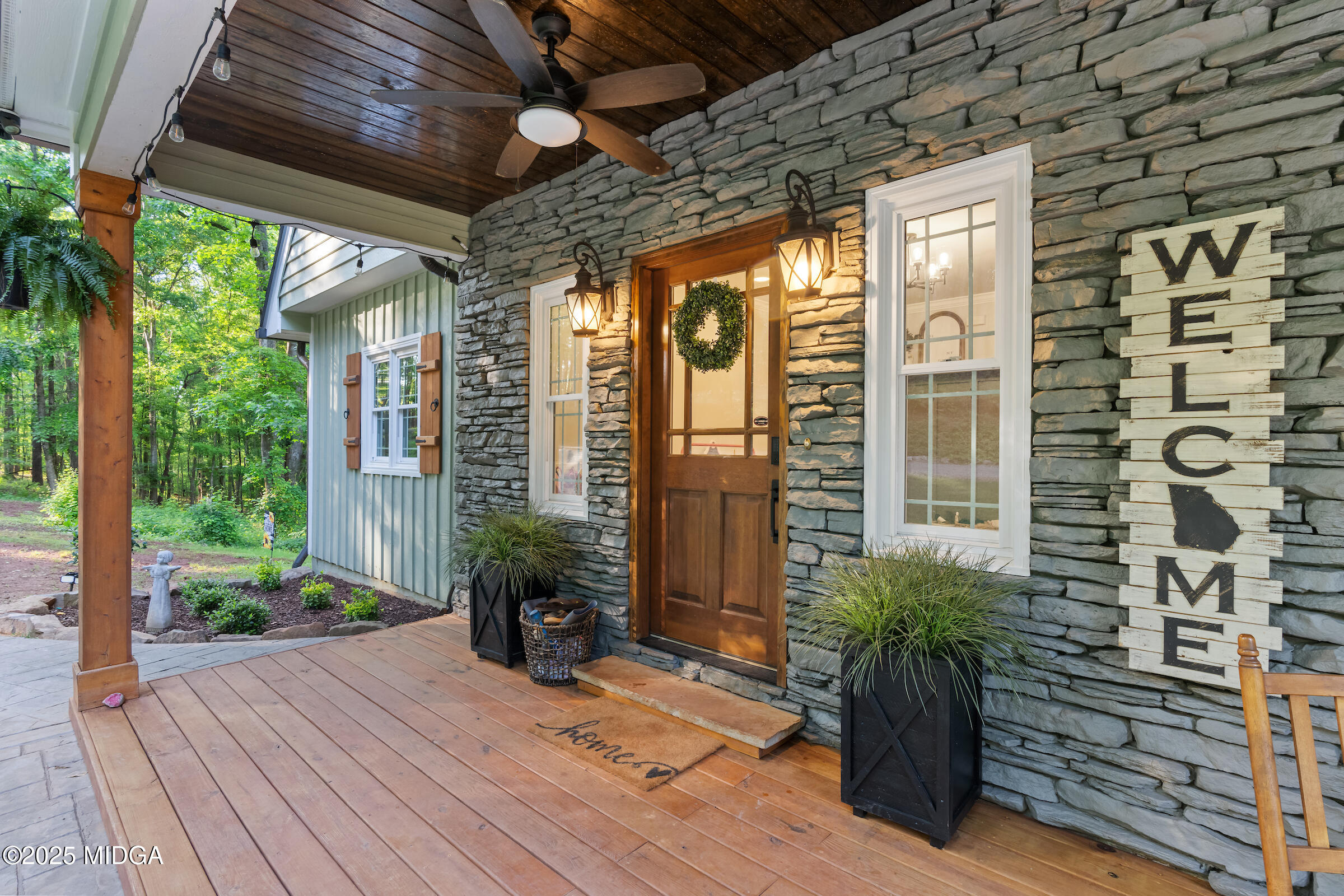 1774 Maynards Mill Road Forsyth, GA 31029 - Photo 24 of 76 a porch with seating space and yard