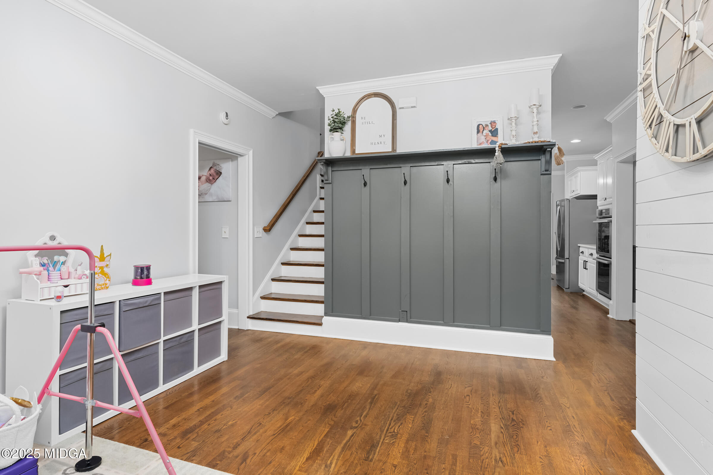 1774 Maynards Mill Road Forsyth, GA 31029 - Photo 26 of 76 a view of a room with wooden floor and staircase