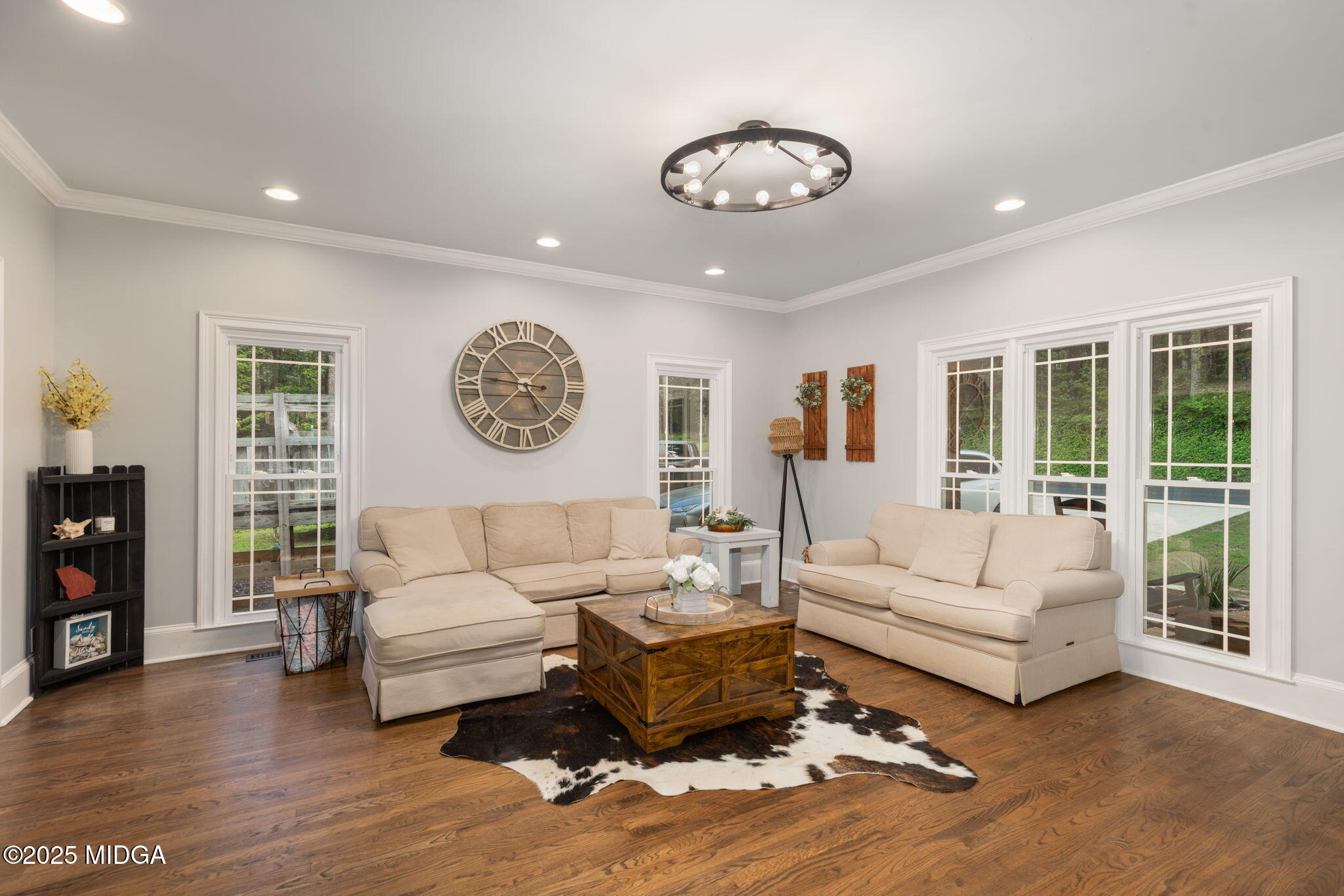 1774 Maynards Mill Road Forsyth, GA 31029 - Photo 28 of 76 a living room with furniture and a large window