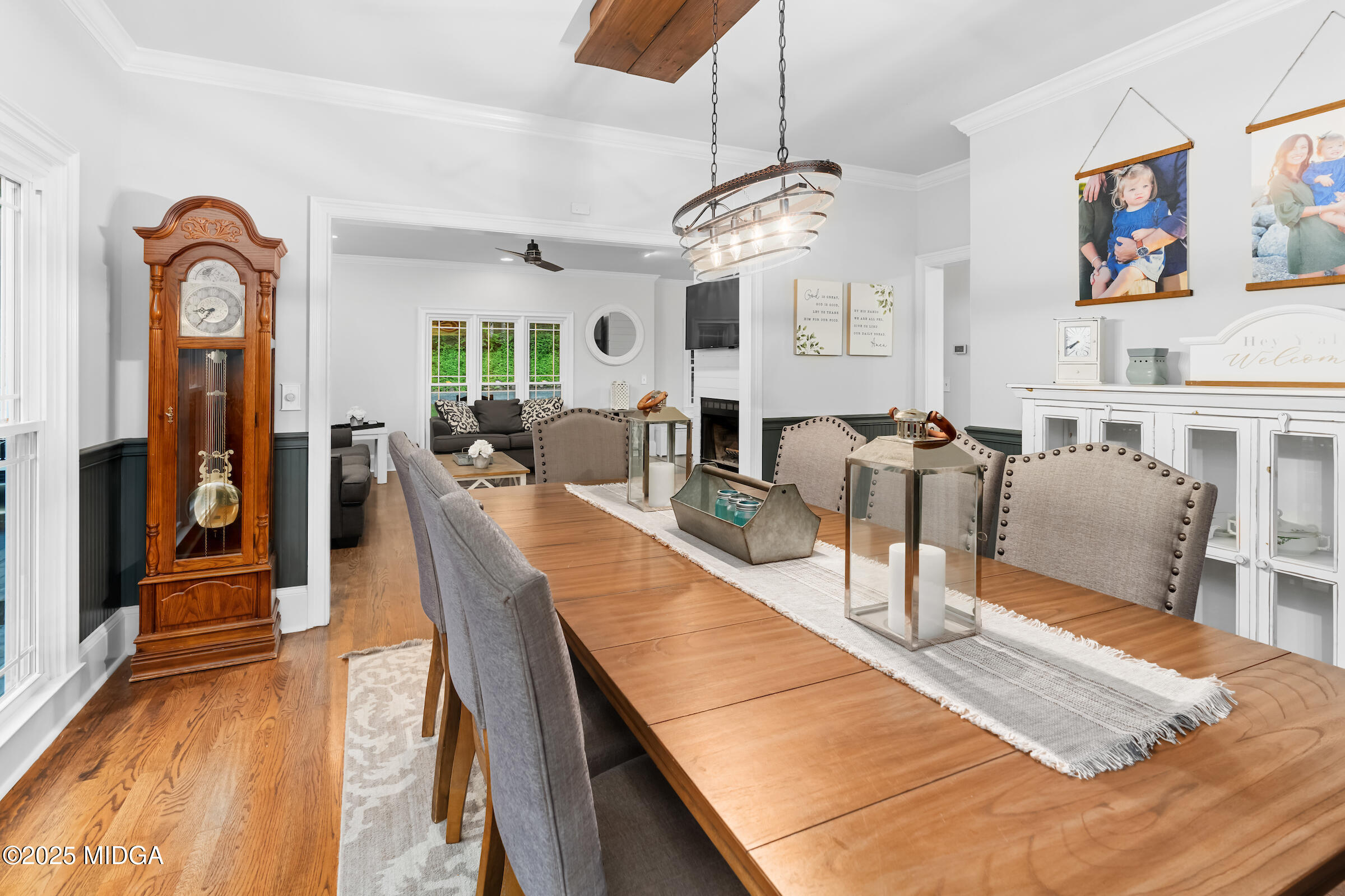 1774 Maynards Mill Road Forsyth, GA 31029 - Photo 31 of 76 a view of a dining room with furniture a chandelier and wooden floor