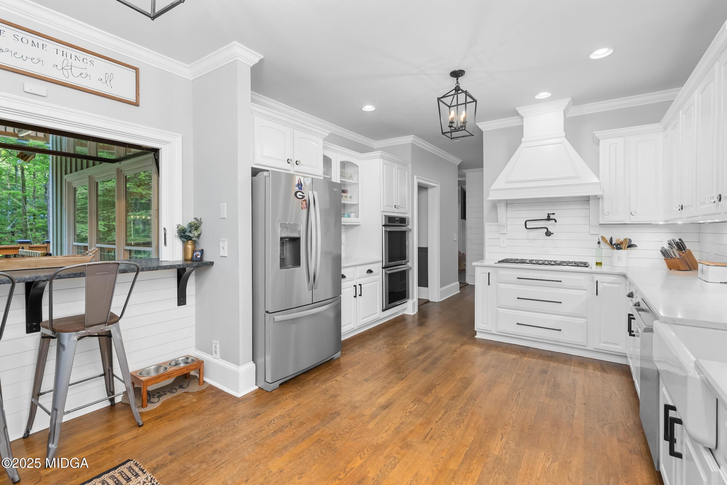 1774 Maynards Mill Road Forsyth, GA 31029 - Photo 33 of 76 a kitchen with kitchen island a counter top space appliances and cabinets