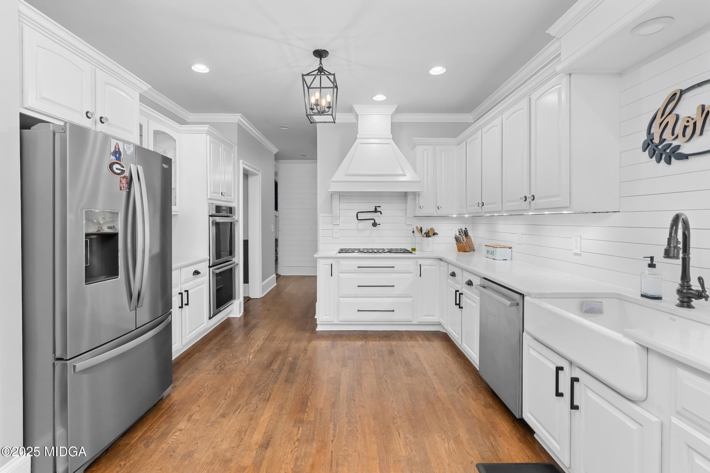 1774 Maynards Mill Road Forsyth, GA 31029 - Photo 34 of 76 a kitchen with stainless steel appliances a refrigerator sink and cabinets