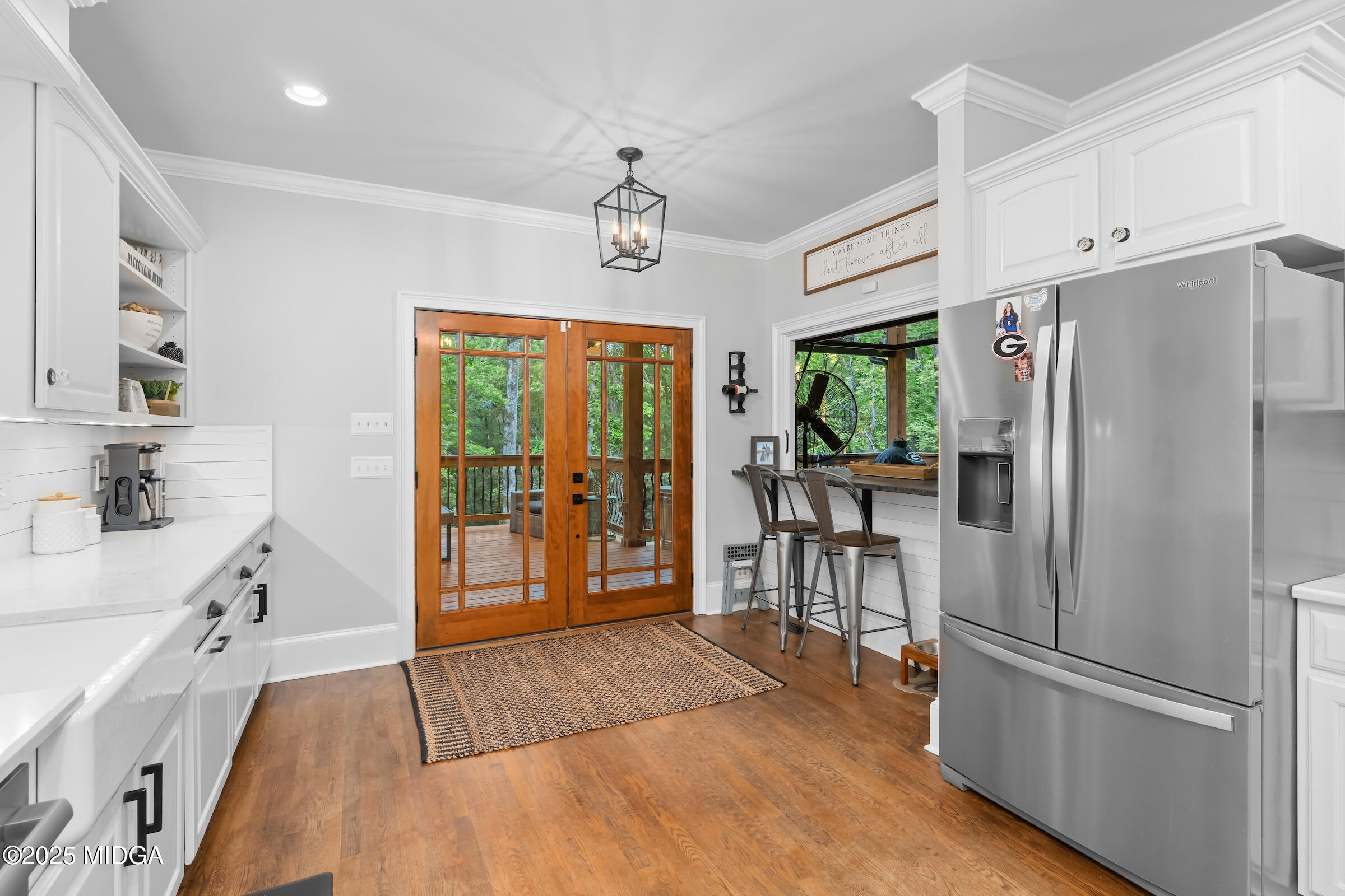 1774 Maynards Mill Road Forsyth, GA 31029 - Photo 36 of 76 a kitchen with stainless steel appliances a refrigerator stove microwave and cabinets