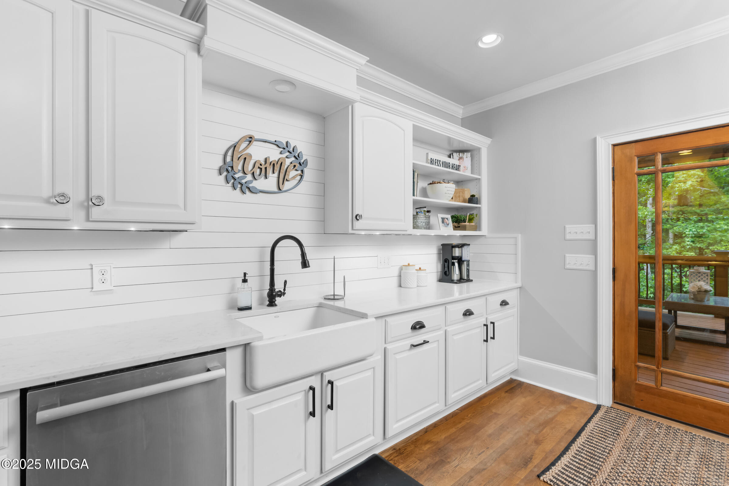 1774 Maynards Mill Road Forsyth, GA 31029 - Photo 37 of 76 a kitchen with stainless steel appliances granite countertop a sink and a stove next to a window