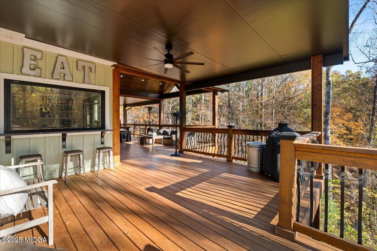 1774 Maynards Mill Road Forsyth, GA 31029 - Photo 40 of 76 a view of a porch with wooden floor