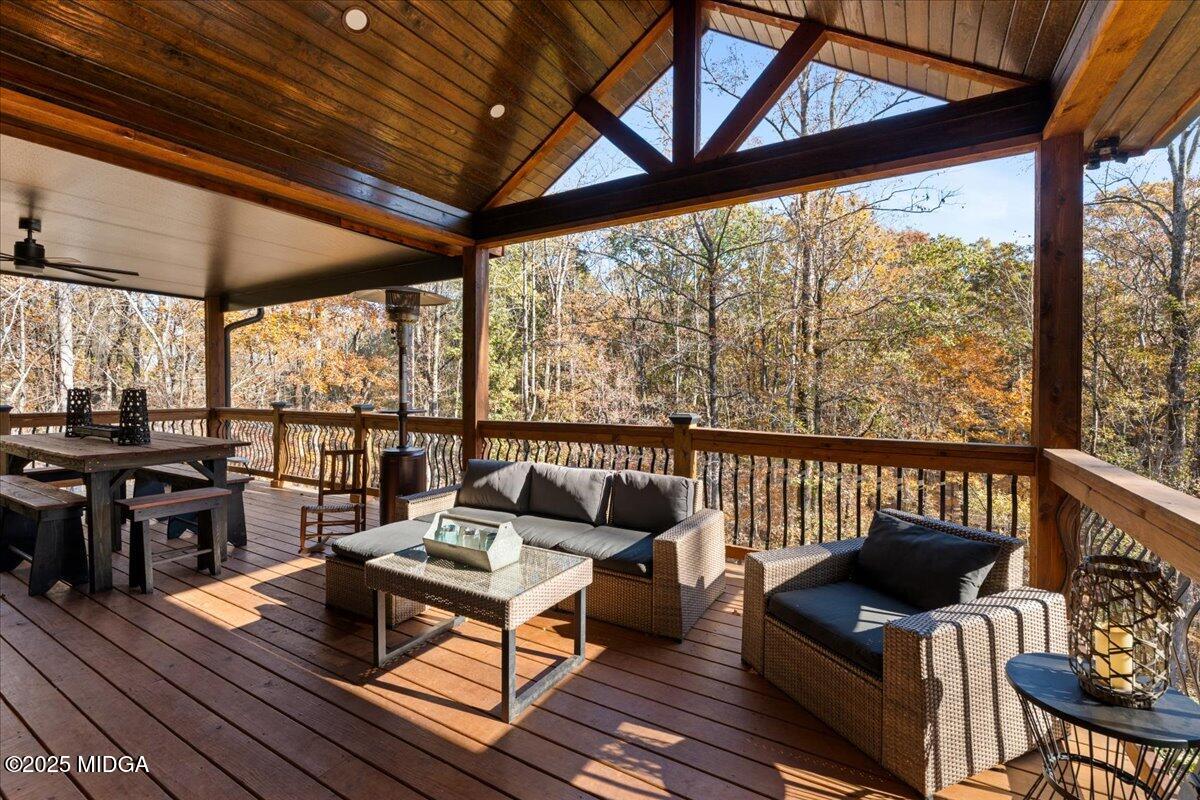 1774 Maynards Mill Road Forsyth, GA 31029 - Photo 41 of 76 a living room with furniture and a wooden floor