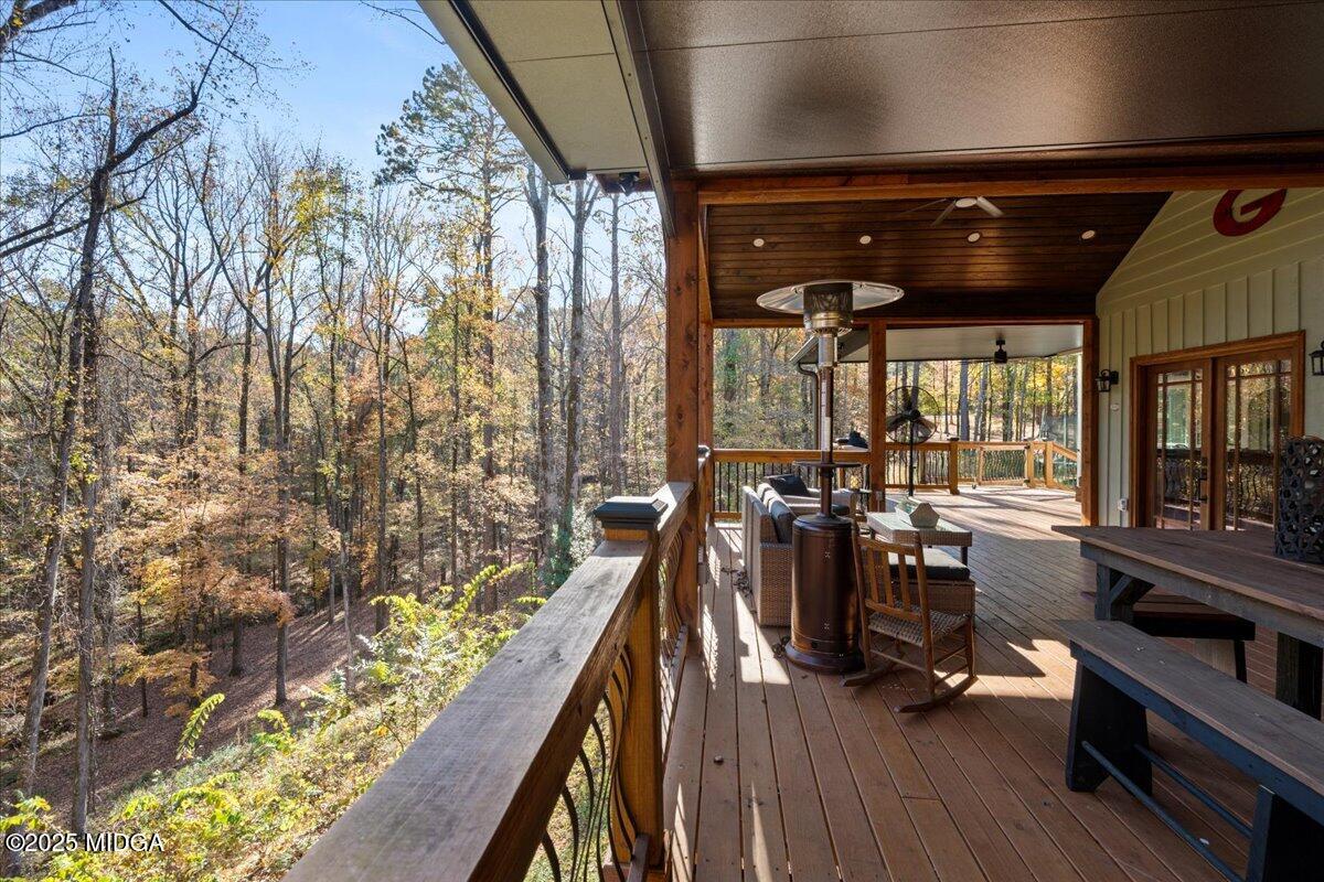 1774 Maynards Mill Road Forsyth, GA 31029 - Photo 42 of 76 a view of a room with lots of wooden furniture and windows