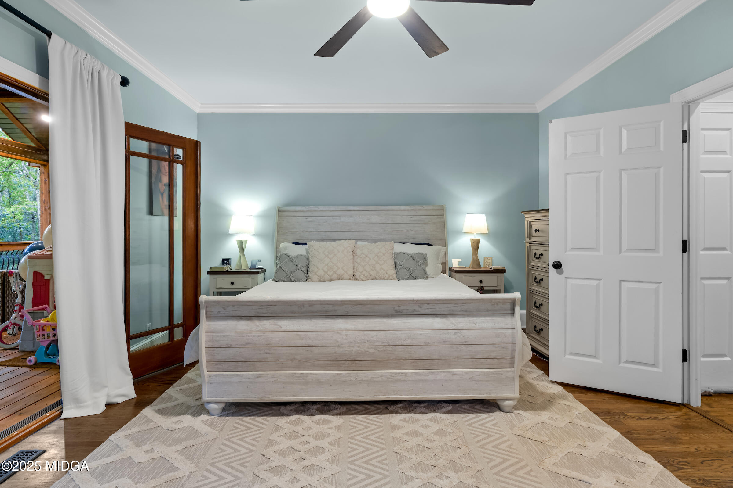 1774 Maynards Mill Road Forsyth, GA 31029 - Photo 47 of 76 a bedroom with a bed and a chandelier