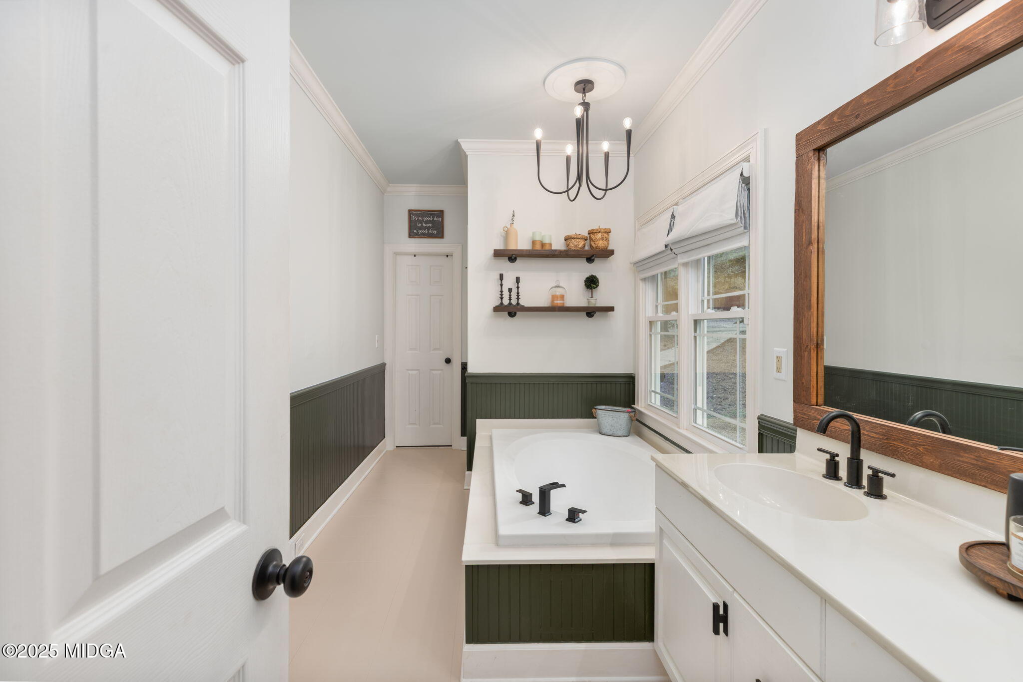 1774 Maynards Mill Road Forsyth, GA 31029 - Photo 48 of 76 a bathroom with a sink and a mirror