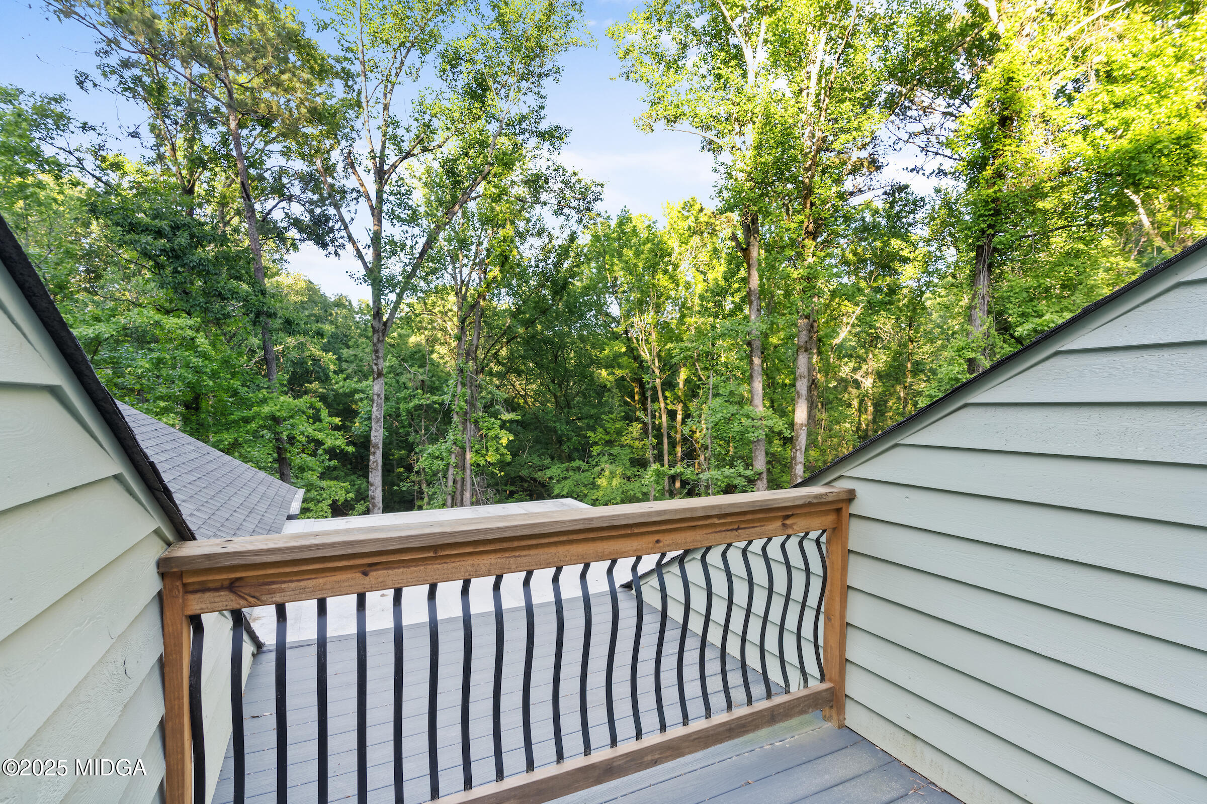 1774 Maynards Mill Road Forsyth, GA 31029 - Photo 62 of 76 a view of a balcony with wooden fence and floor