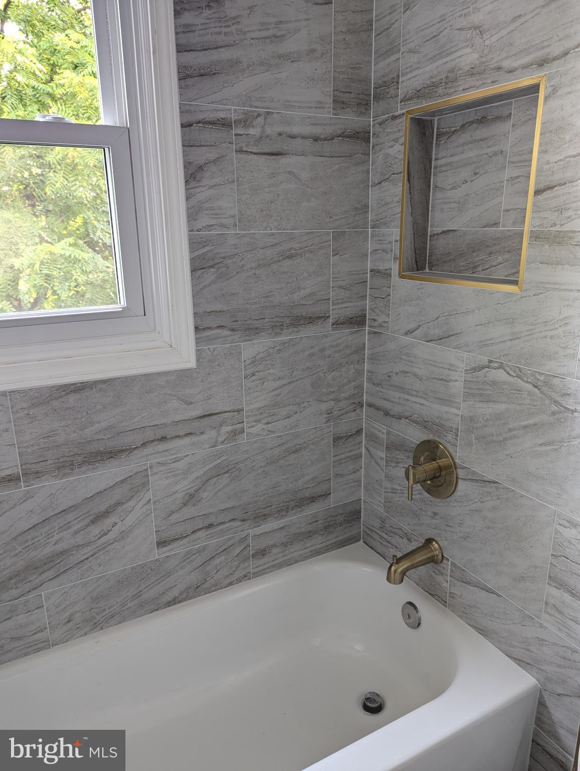 2700 Dawson Avenue Silver Spring, MD 20902 - Photo 9 of 11 a bathroom with a tub