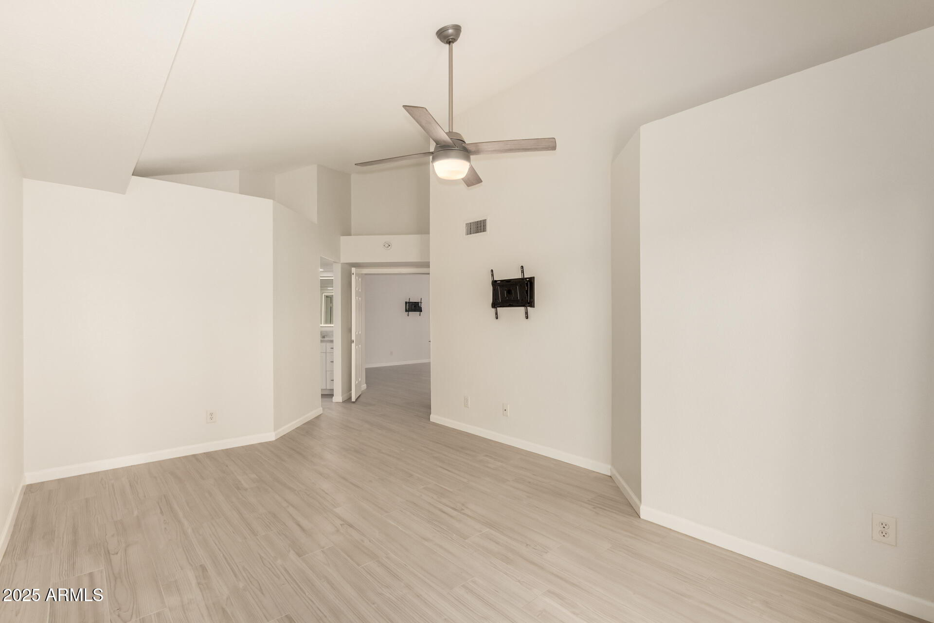 11860 North 40th Way Phoenix, AZ 85028 - Photo 14 of 31 a view of a kitchen with wooden floor a ceiling fan and refrigerator