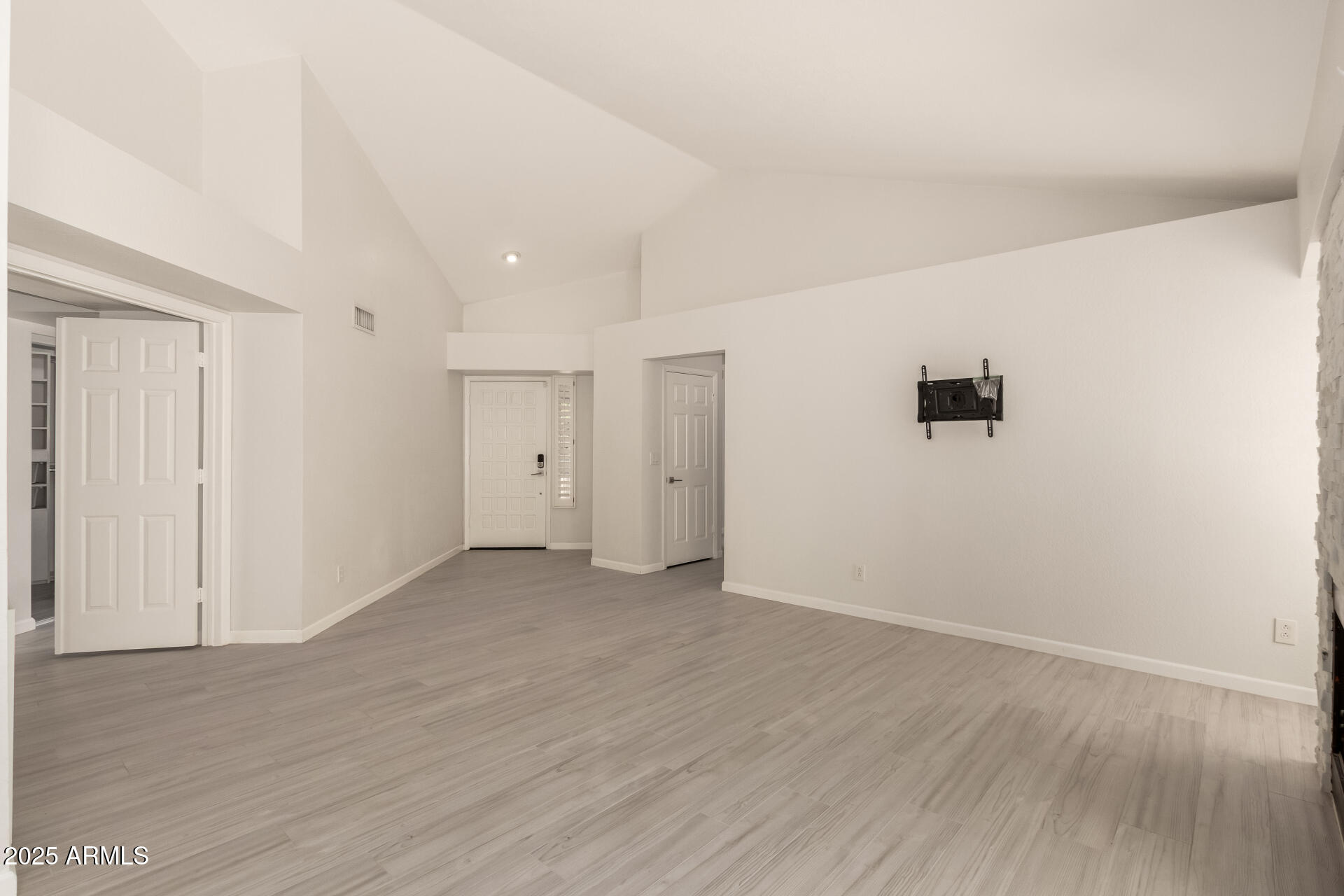 11860 North 40th Way Phoenix, AZ 85028 - Photo 6 of 31 a view of an empty room with wooden floor