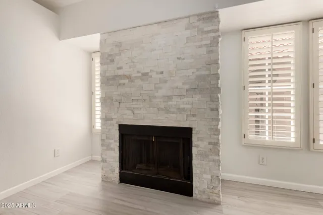 a room with a fireplace and a fireplace