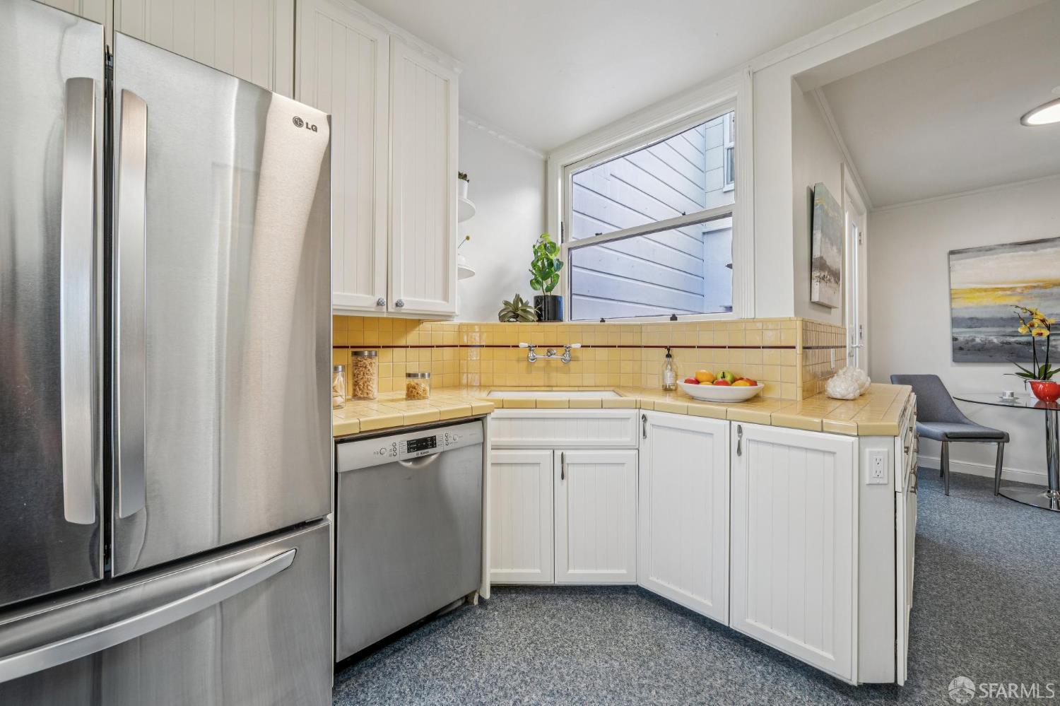 473 Melrose Avenue San Francisco, CA 94127 - Photo 28 of 94 a kitchen with a sink and a refrigerator