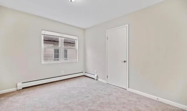 an empty room with a empty space and windows