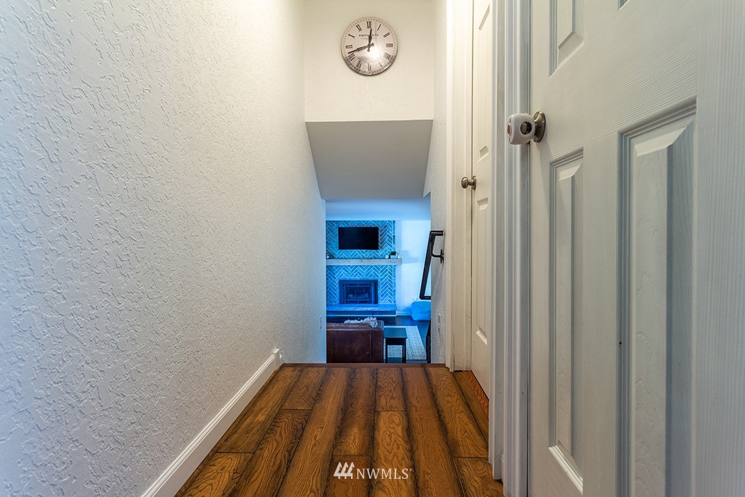 10025 Northeast 204th Street Bothell, WA 98011 - Photo 22 of 40 a view of a hallway with wooden floor and entryway