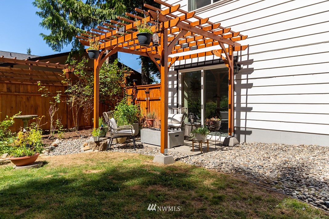 10025 Northeast 204th Street Bothell, WA 98011 - Photo 34 of 40 a view of a house with backyard and sitting area