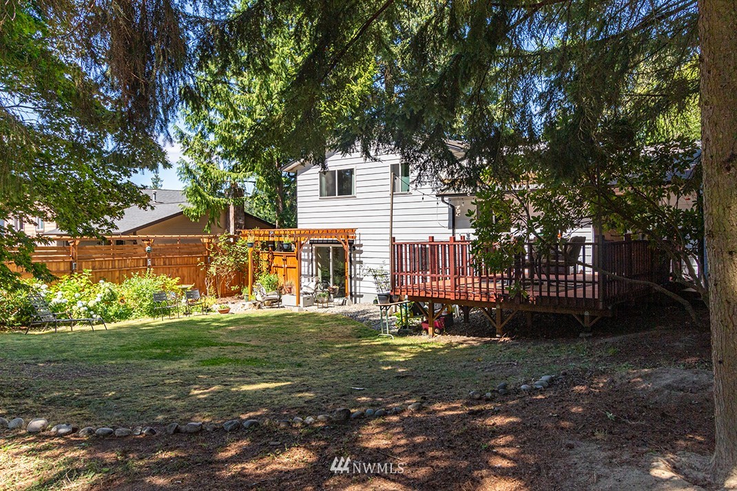 10025 Northeast 204th Street Bothell, WA 98011 - Photo 35 of 40 a view of a house with a yard