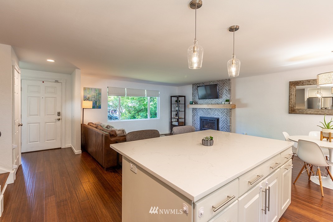 10025 Northeast 204th Street Bothell, WA 98011 - Photo 9 of 40 a view of a kitchen center island and wooden floor