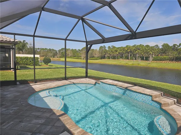 a view of a swimming pool with a porch