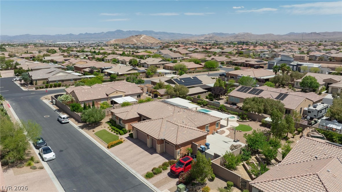8431 Durango Ranch Court Las Vegas, NV 89113 - Photo 46 of 49 An aerial perspective reveals a serene suburban landscape under a vast sky.