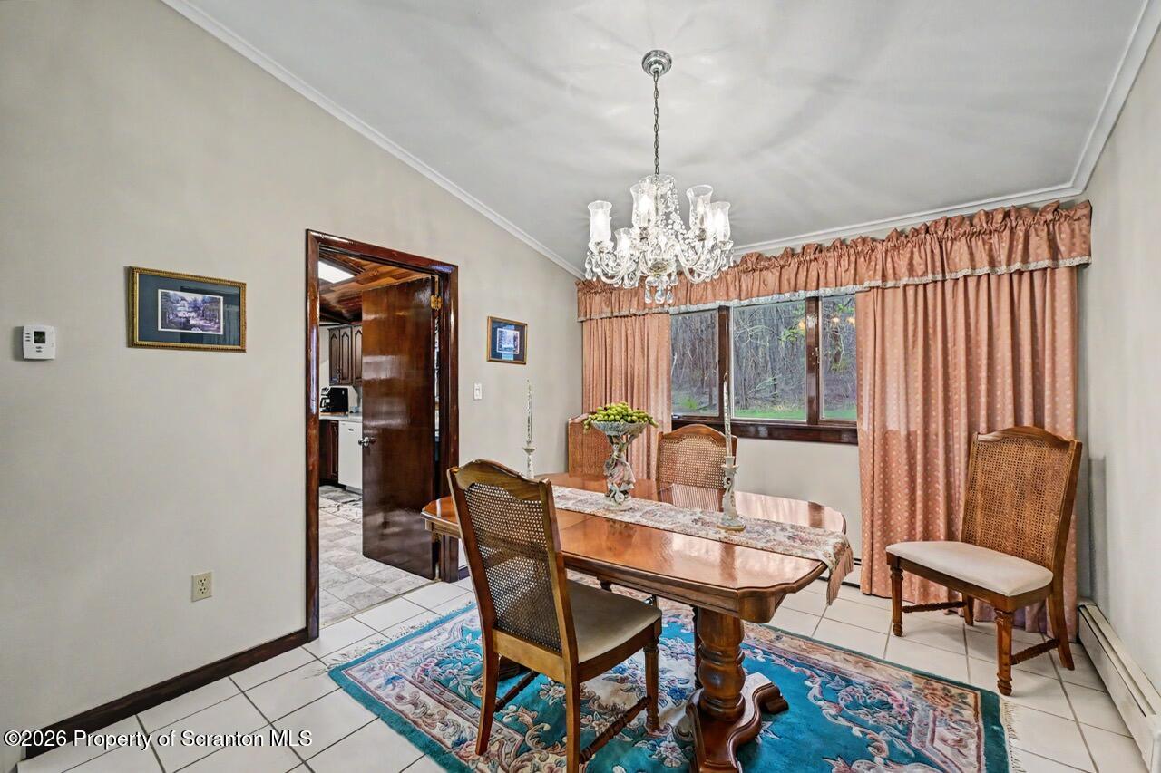 73 Quinton Road Scott Township, PA 18447 - Photo 11 of 64 a view of a dining room with furniture and chandelier