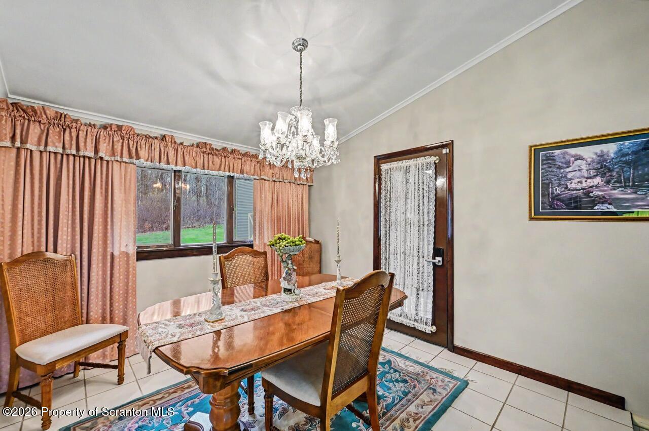 73 Quinton Road Scott Township, PA 18447 - Photo 12 of 64 a view of a dining room with furniture window and outside view