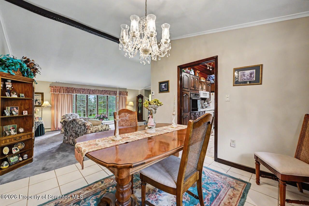 73 Quinton Road Scott Township, PA 18447 - Photo 13 of 64 a dining room with furniture and chandelier