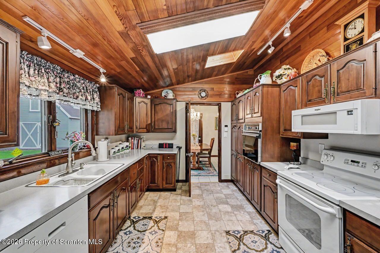73 Quinton Road Scott Township, PA 18447 - Photo 15 of 64 a large kitchen with stainless steel appliances granite countertop a sink and cabinets