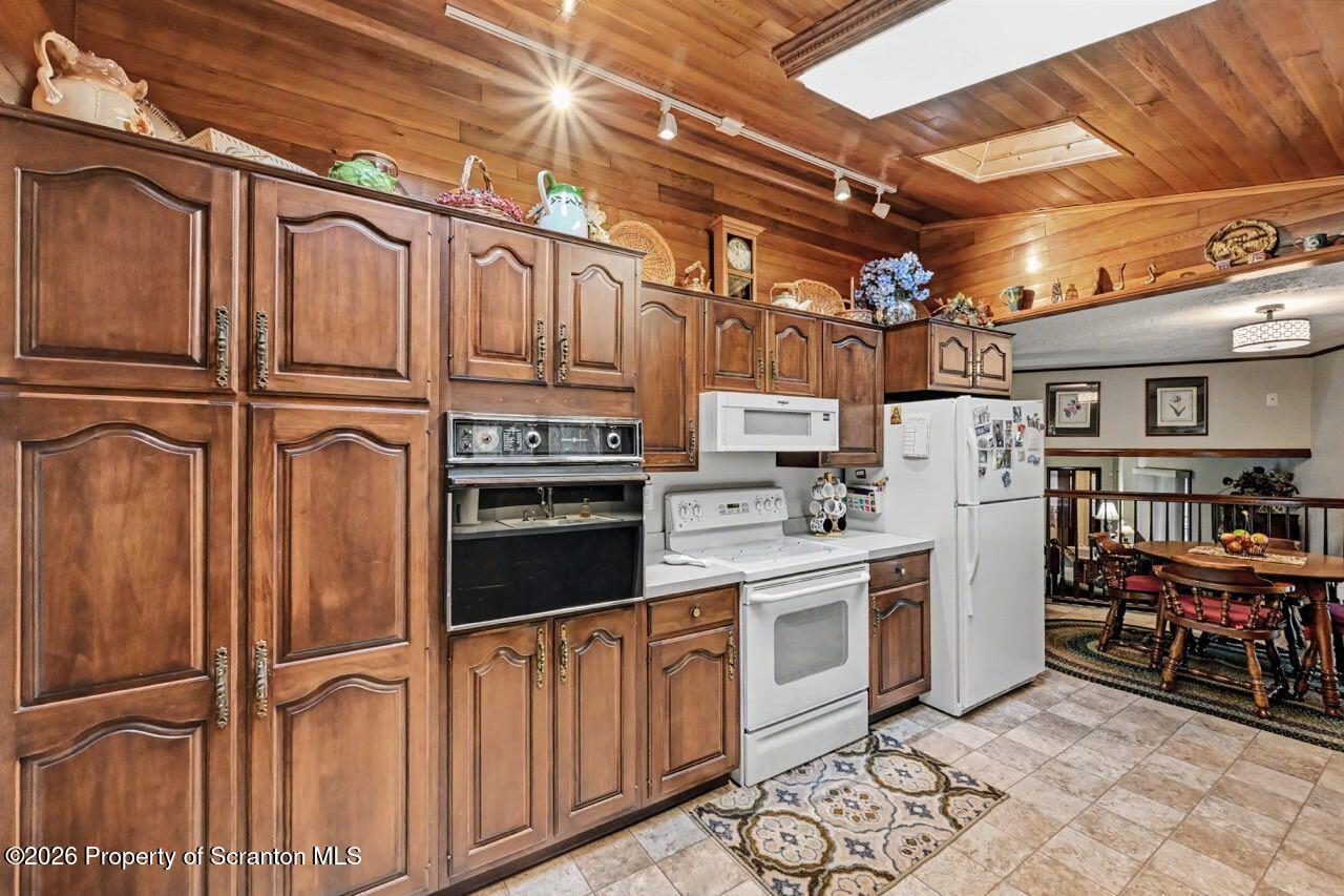 73 Quinton Road Scott Township, PA 18447 - Photo 17 of 64 a kitchen with stainless steel appliances granite countertop a refrigerator and cabinets