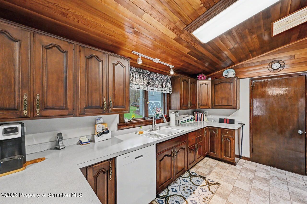 73 Quinton Road Scott Township, PA 18447 - Photo 20 of 64 a kitchen with a sink stove and cabinets