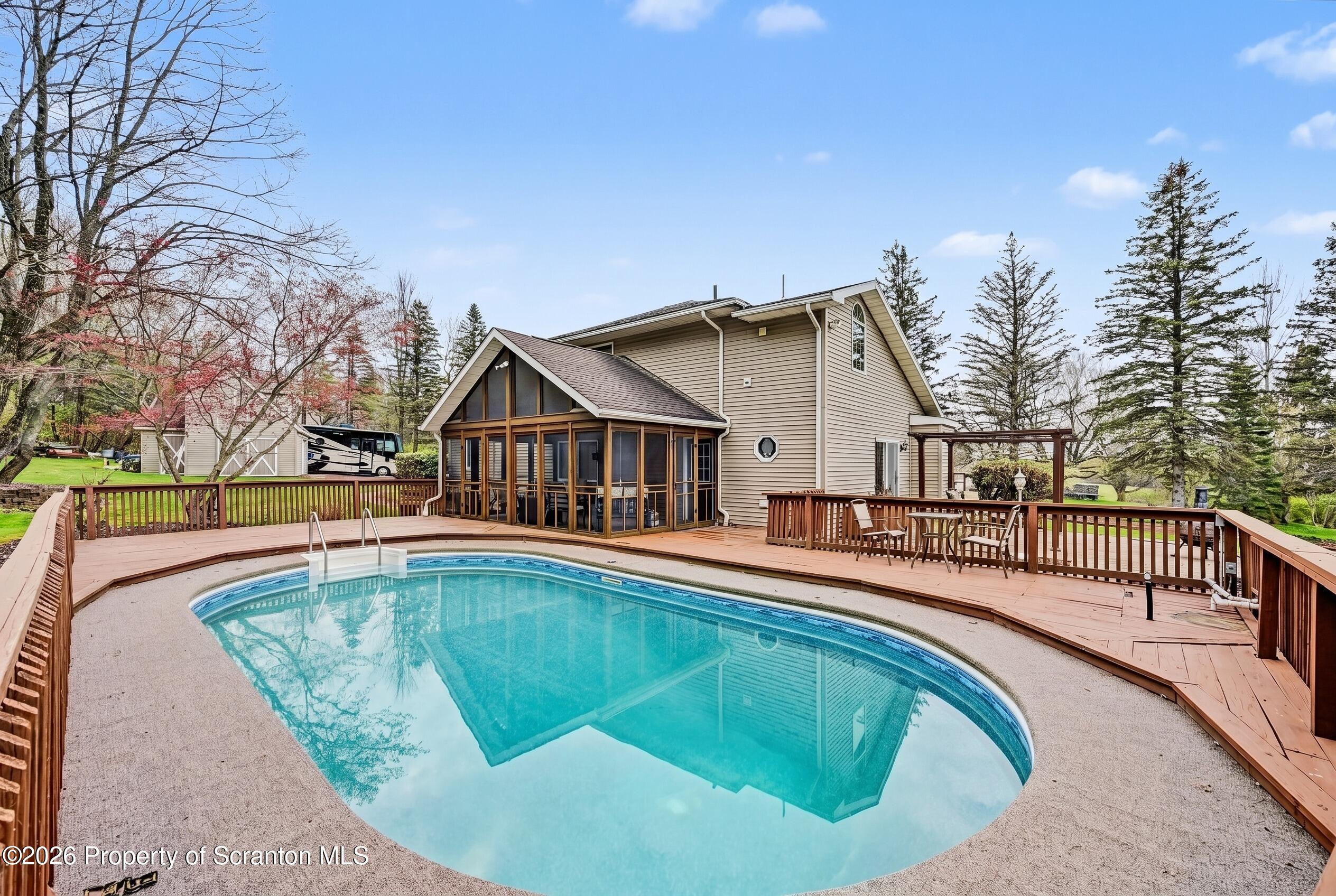 73 Quinton Road Scott Township, PA 18447 - Photo 2 of 64 a view of a house with swimming pool and sitting area
