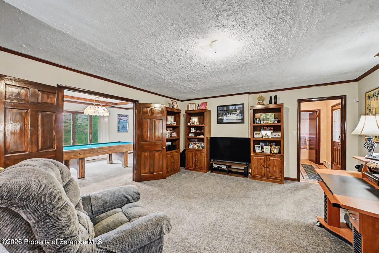 73 Quinton Road Scott Township, PA 18447 - Photo 24 of 64 a living room with furniture and a flat screen tv