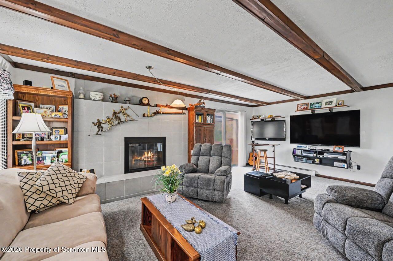 73 Quinton Road Scott Township, PA 18447 - Photo 28 of 64 a living room with furniture and a flat screen tv