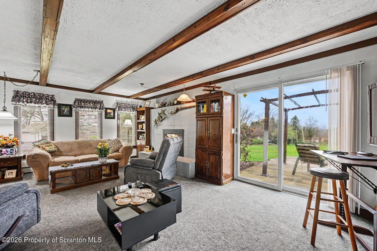 73 Quinton Road Scott Township, PA 18447 - Photo 30 of 64 a living room with furniture and a floor to ceiling window