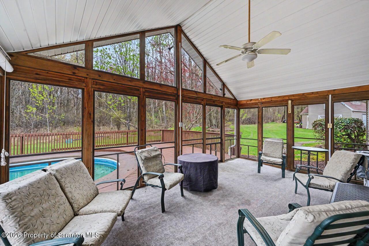 73 Quinton Road Scott Township, PA 18447 - Photo 33 of 64 a living room with furniture and a floor to ceiling window