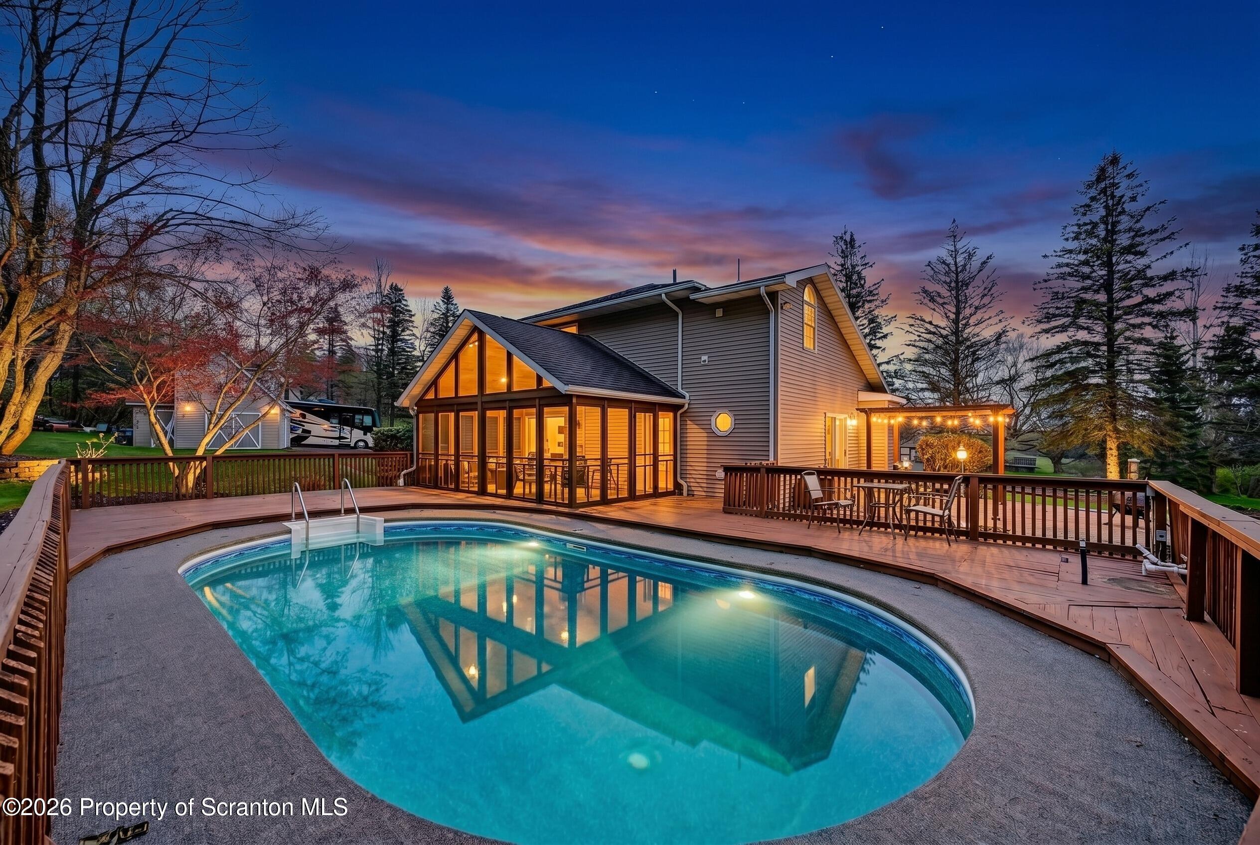 73 Quinton Road Scott Township, PA 18447 - Photo 36 of 64 a view of a swimming pool with a porch
