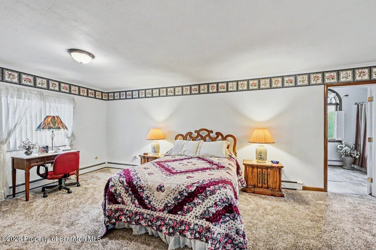 73 Quinton Road Scott Township, PA 18447 - Photo 37 of 64 a bedroom with a bed and a window