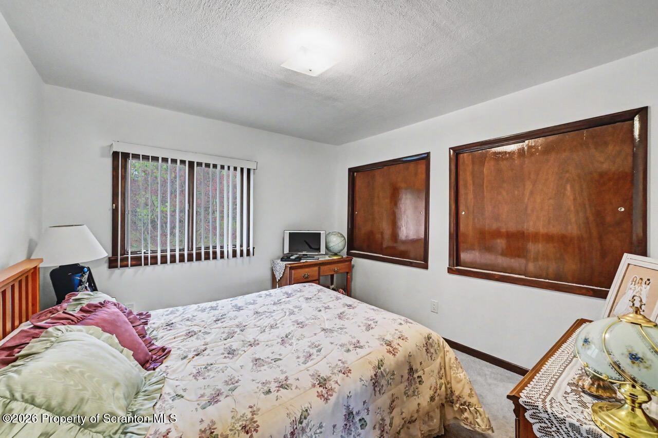73 Quinton Road Scott Township, PA 18447 - Photo 47 of 64 a bedroom with a bed and a window