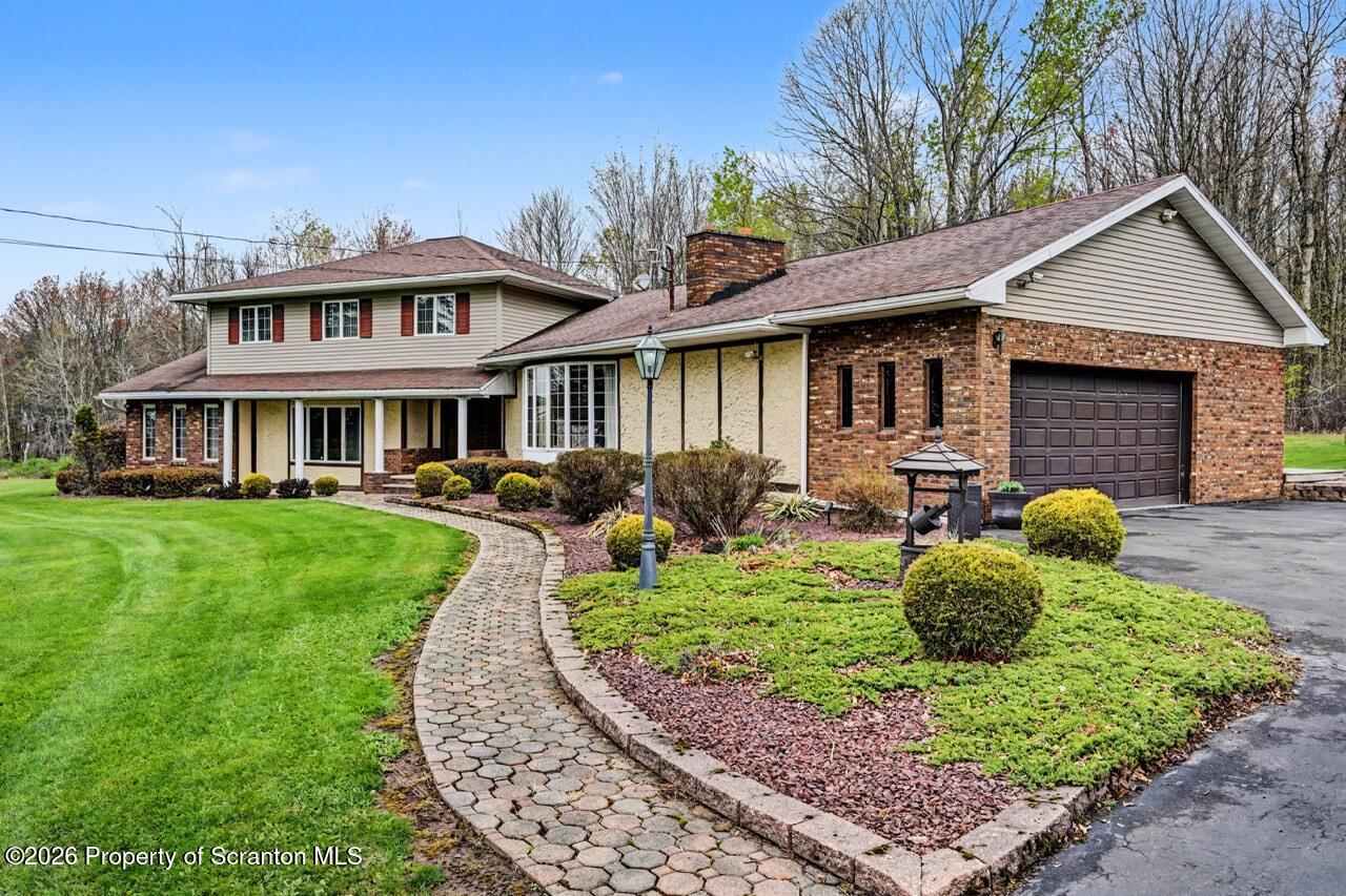 73 Quinton Road Scott Township, PA 18447 - Photo 62 of 64 a front view of house with yard and green space