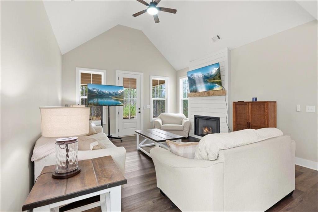 1270 McGarity Road Temple, GA 30179 - Photo 11 of 58 a living room with furniture a fireplace and a table