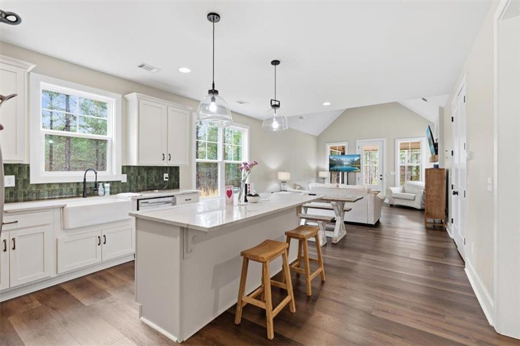 1270 McGarity Road Temple, GA 30179 - Photo 15 of 58 a large white kitchen with lots of counter space a sink and appliances