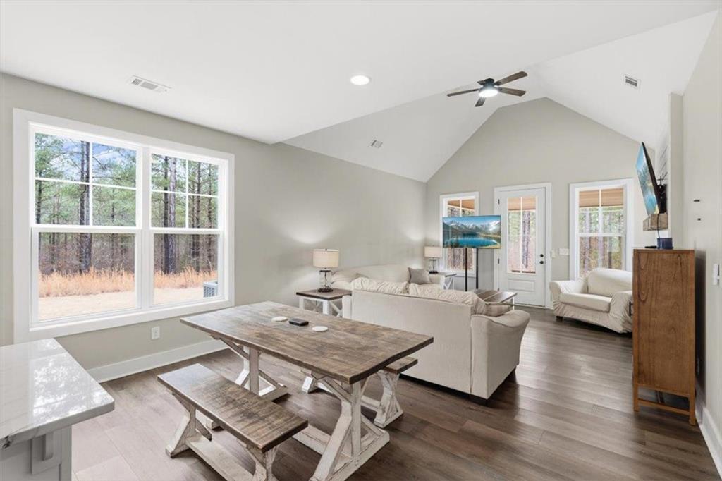 1270 McGarity Road Temple, GA 30179 - Photo 21 of 58 a living room with furniture a table and a large window