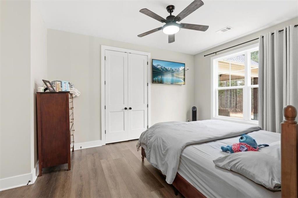 1270 McGarity Road Temple, GA 30179 - Photo 25 of 58 a bedroom with a large bed and a window