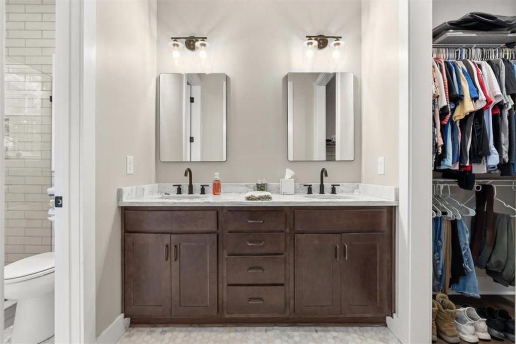 1270 McGarity Road Temple, GA 30179 - Photo 26 of 58 a bathroom with a double vanity sink a and two mirror
