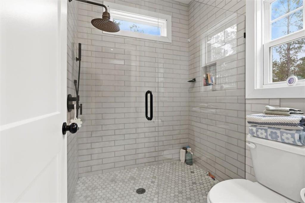 1270 McGarity Road Temple, GA 30179 - Photo 27 of 58 a bathroom with a toilet and a shower